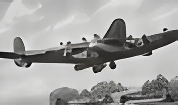 Black-and-white photograph of a Lancaster bomber in flight